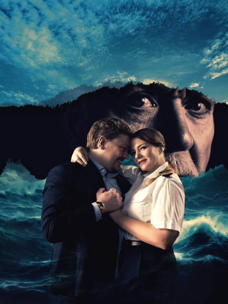 Luisa och Rodolfo omfamnar varandra. Bakom dem syns ett stormigt hav och en mörk ö, där greve Walters ansikte syns.